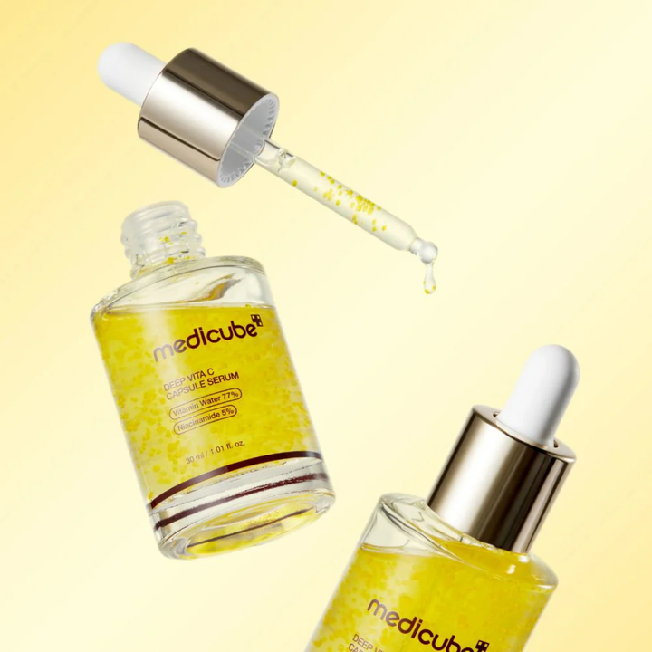 Medicube Deep Vita C Capsule Serum floating bottle and dropper